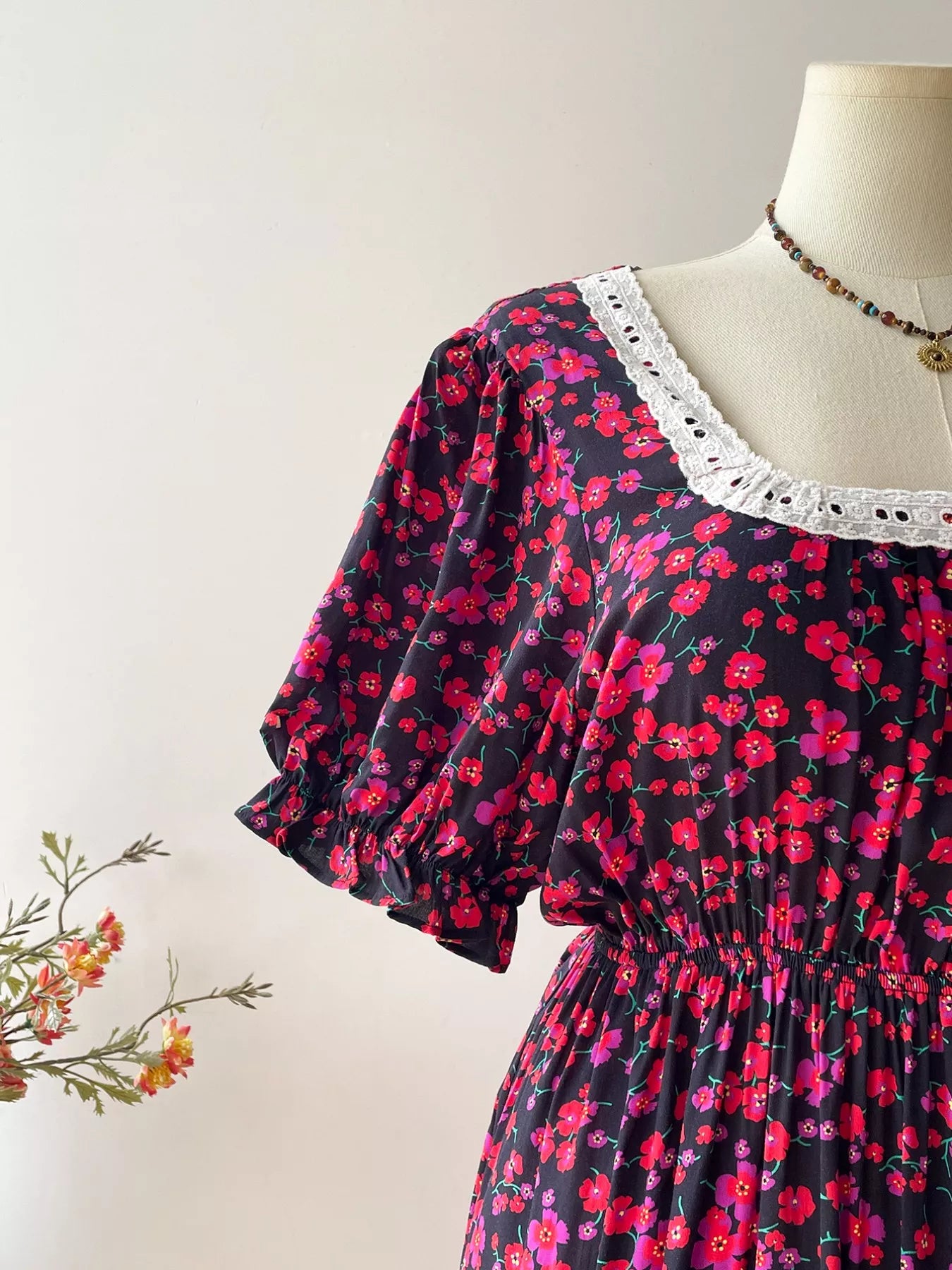 Side view of plus size floral square neck short sleeve dress
