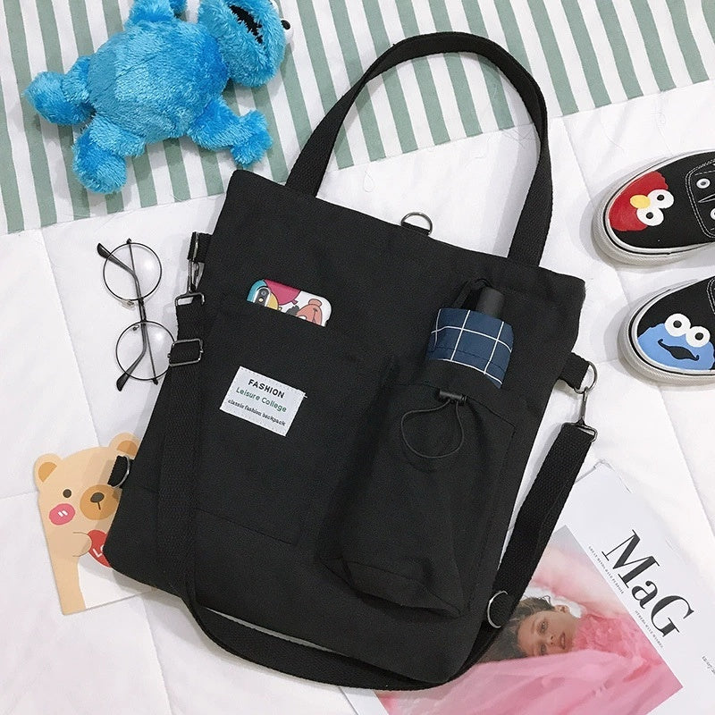 Harajuku Canvas Bags Students Handbag With Pockets on a desk
