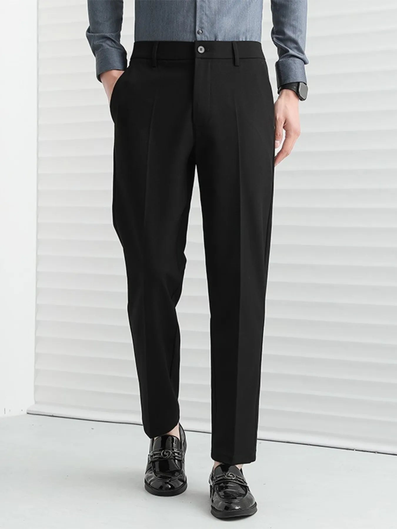 Men's straight leg pants on model walking