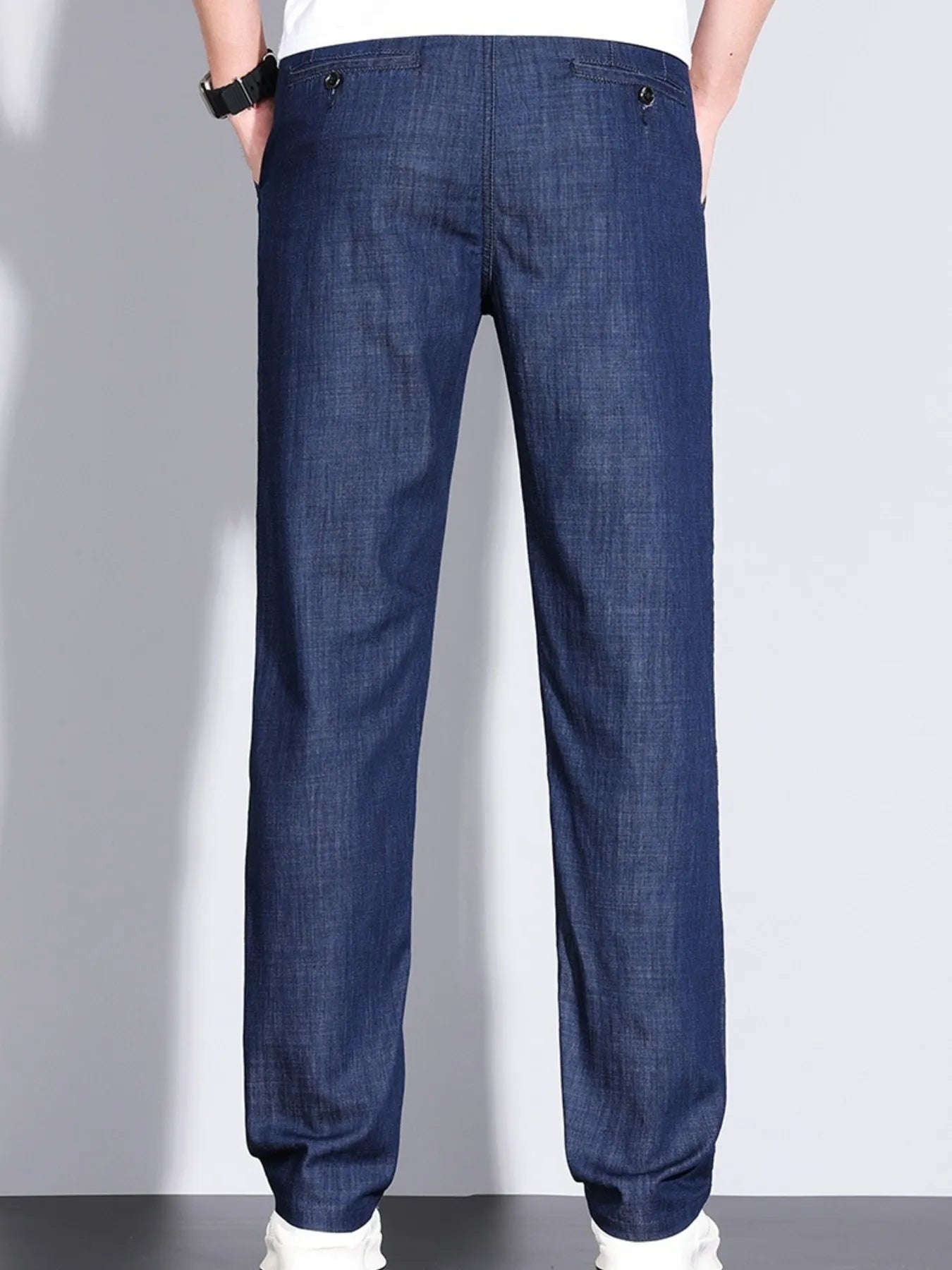 Back view of men’s denim straight leg jeans