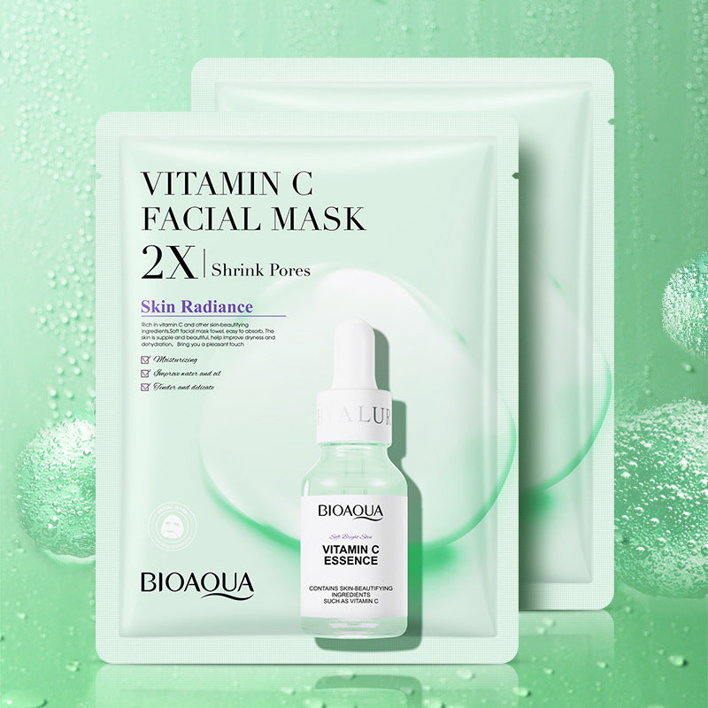Collagen face mask tube and fresh botanical ingredients on white background