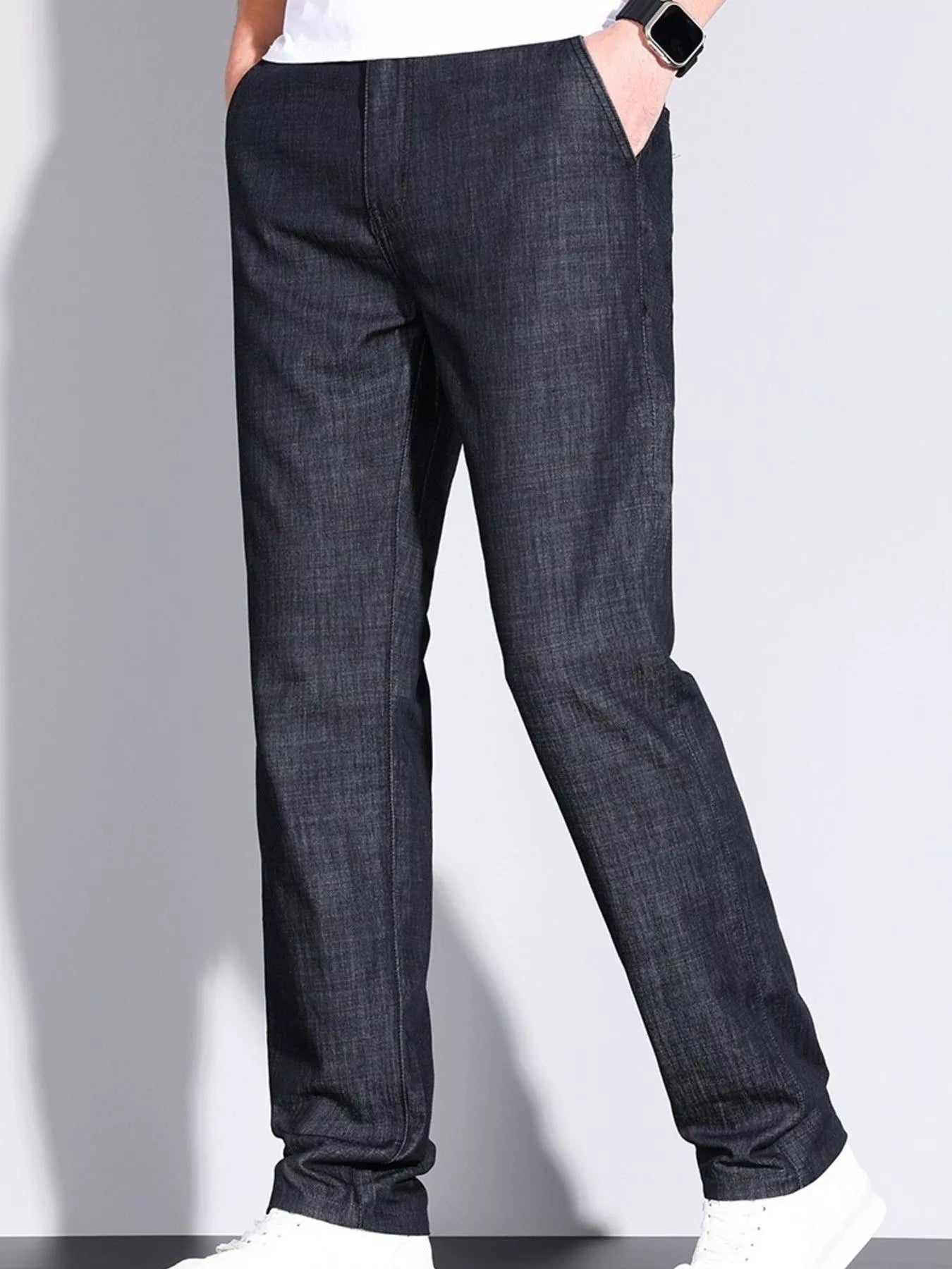 Model wearing men’s denim straight leg jeans front angle