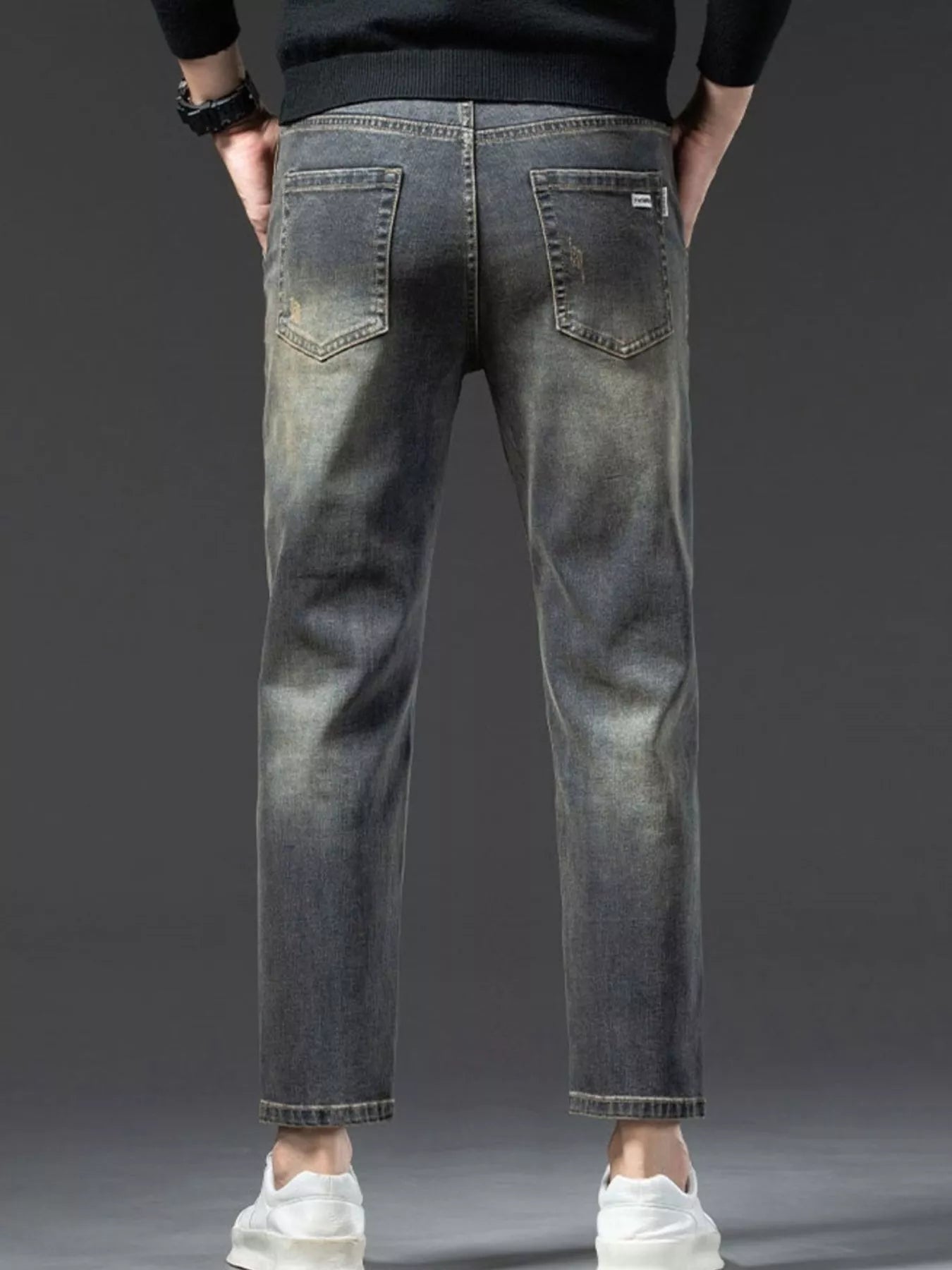 Back view of vintage wash jeans for men with pockets