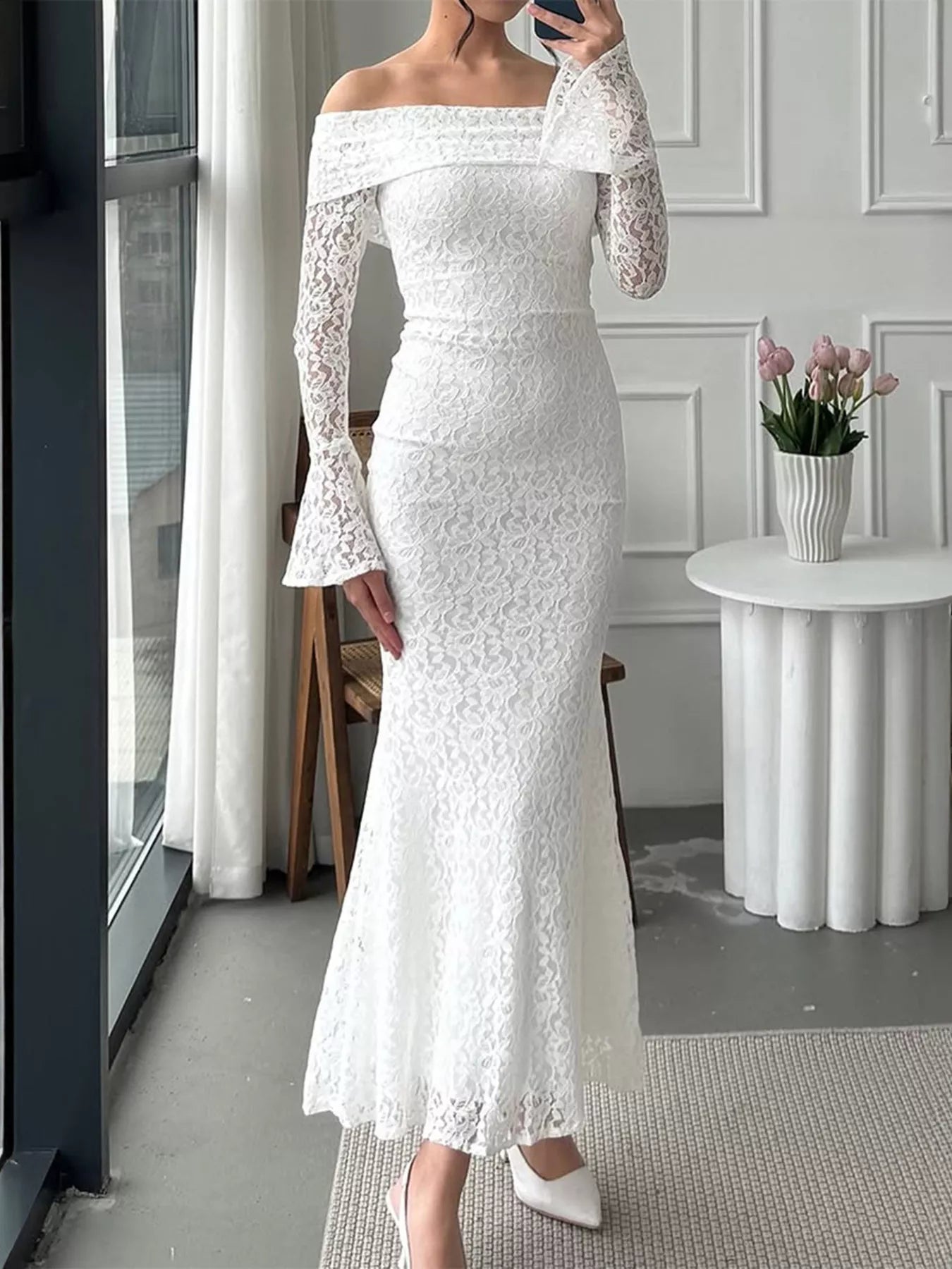 Off-shoulder lace bodycon maxi dress on model standing