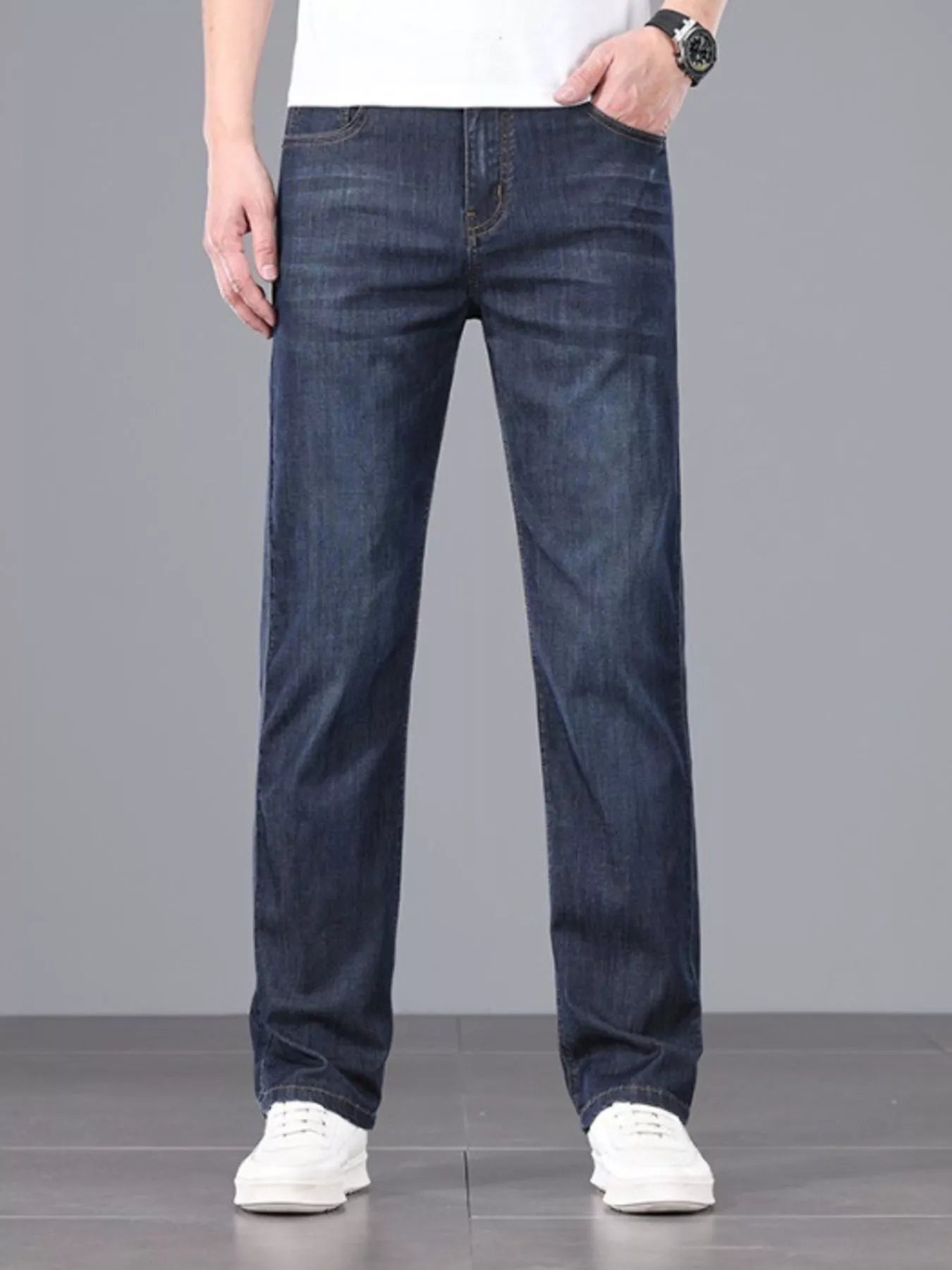 Men's straight fit wash jeans styled with sneakers