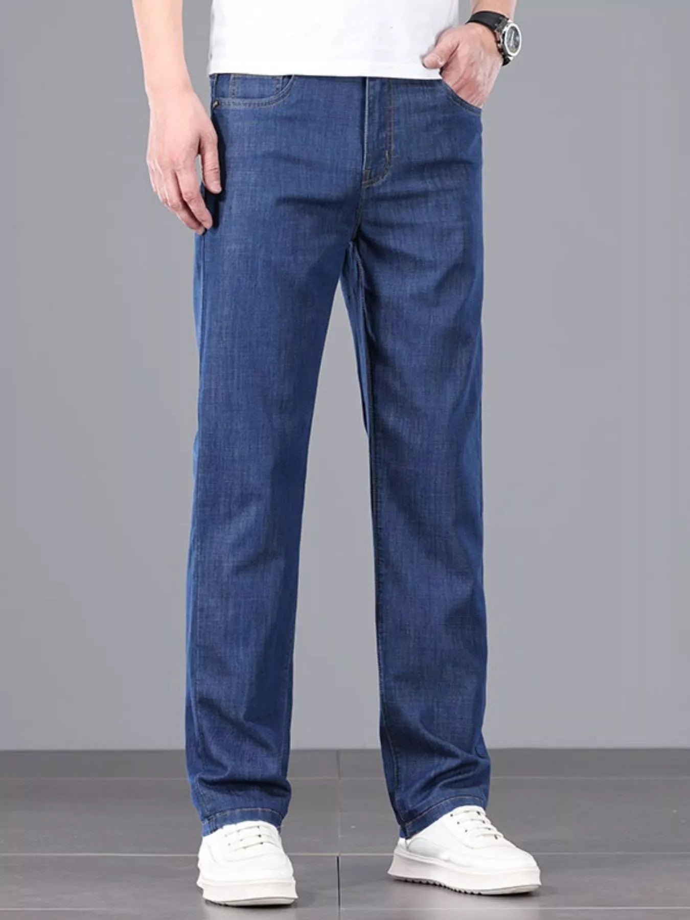 Comfortable men's straight leg jeans styled with sneakers