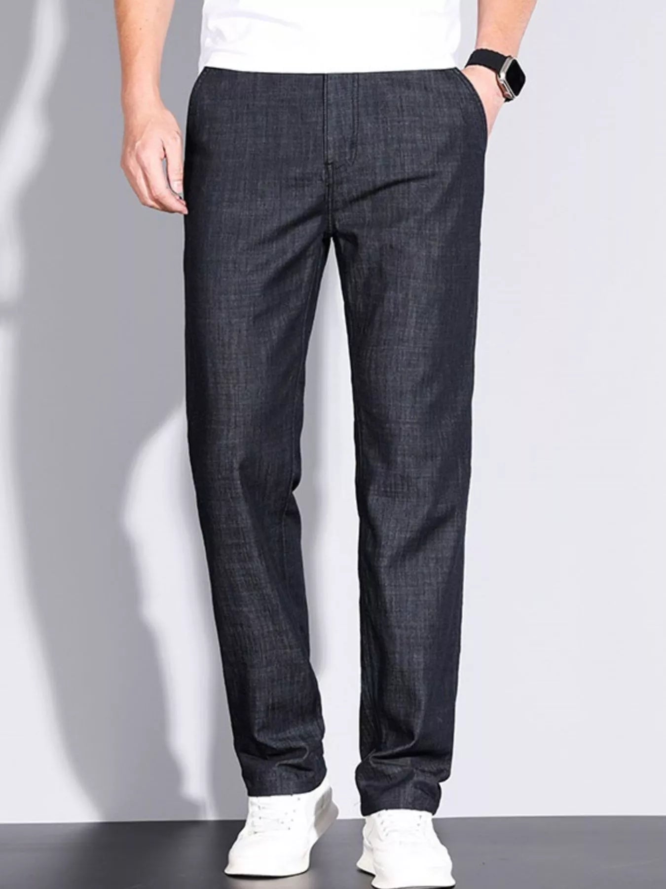 Close-up of men’s denim straight leg jeans fabric