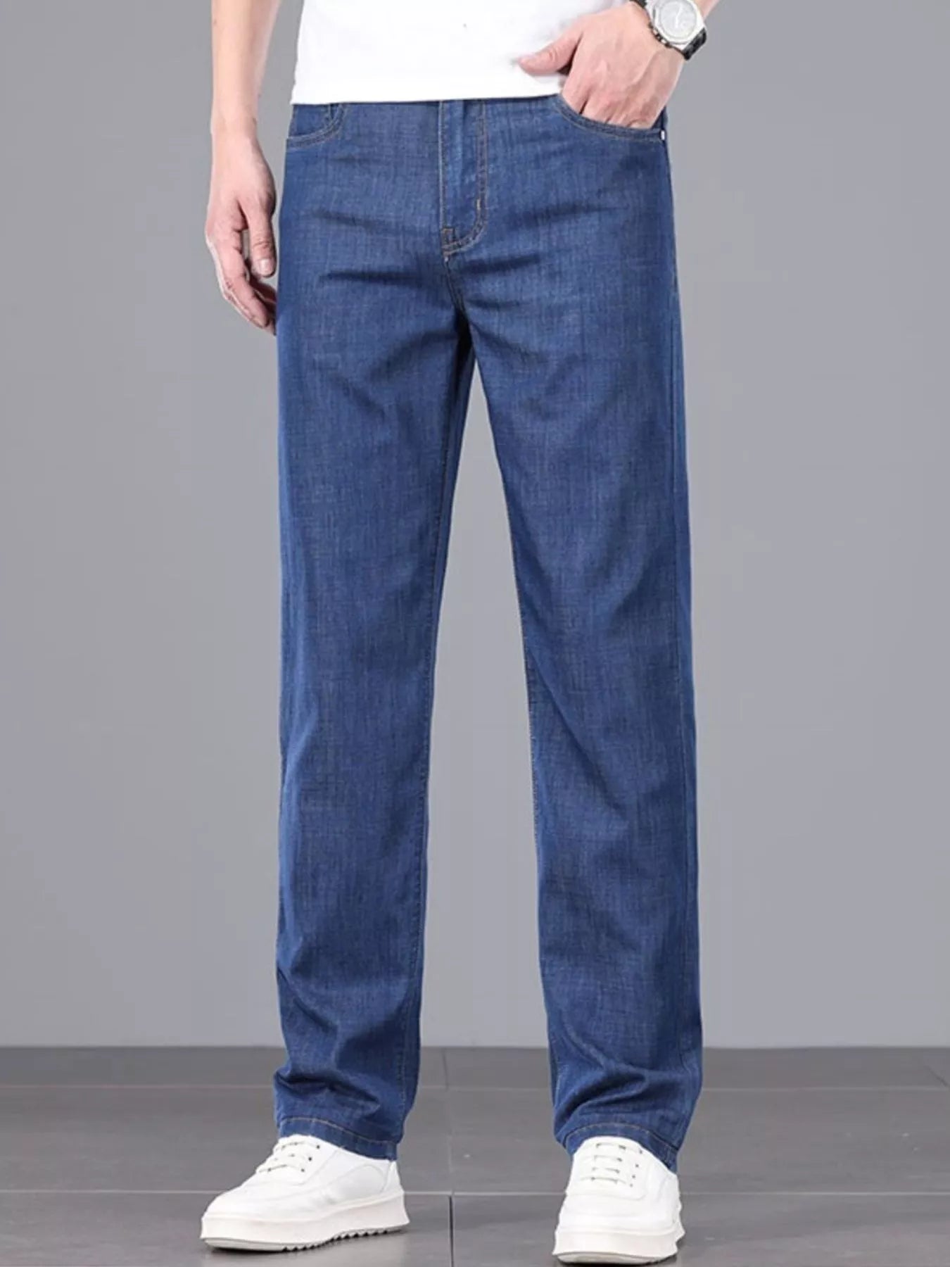 Comfortable men's straight leg jeans on model standing